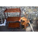 A Victorian mahogany three tier serpentine fronted whatnot; together with a cake stand.