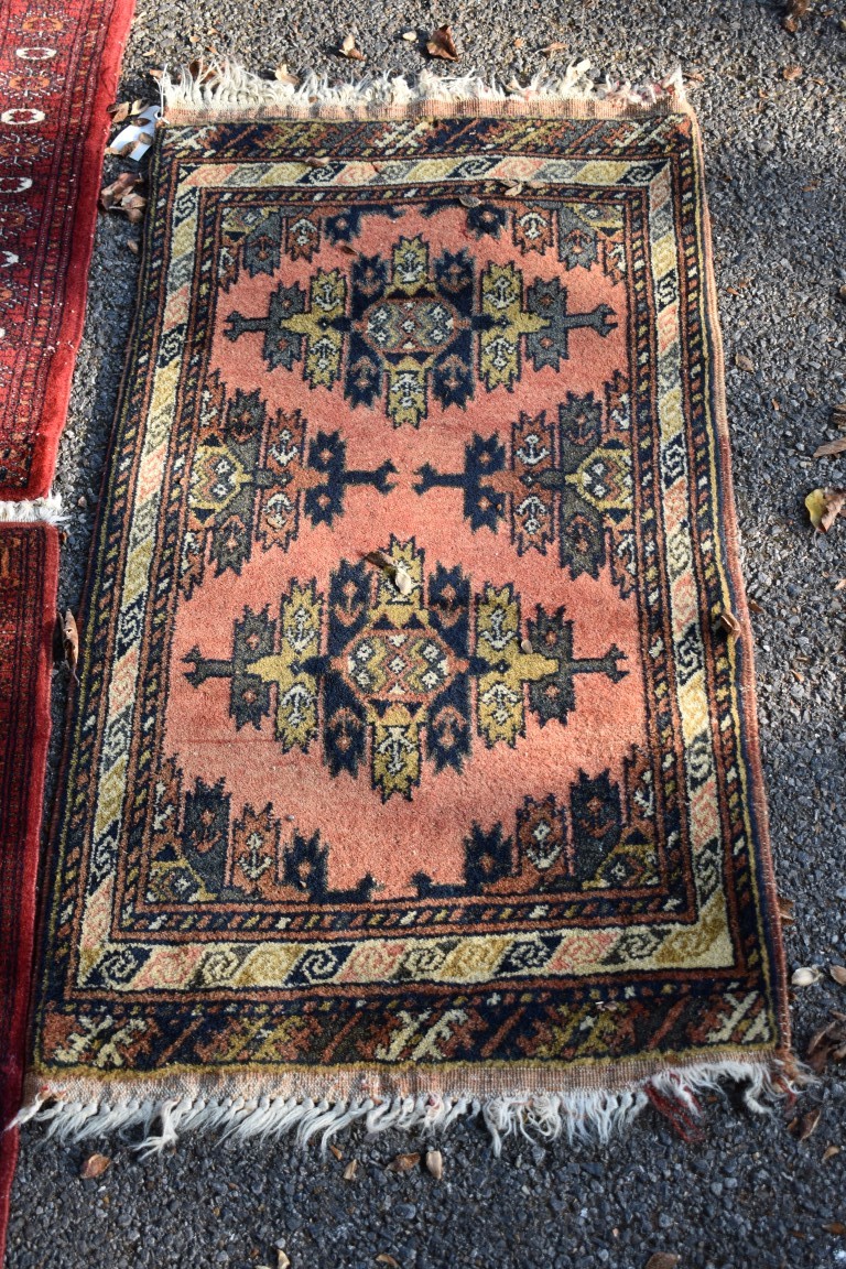 Two small Bokhara rugs; together with another small rug having geometric decoration. - Image 3 of 5