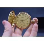 A Zenith 14k 'Grand Prix Paris 1900' stem wind hunter pocket watch, 48mm.