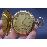 A vintage 14k engine turned gold stem wind pocket watch, 49mm.