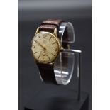 A 1960s Smiths 9ct gold manual wind wristwatch, cal 44, hallmarked London 1963, 36mm, on brown