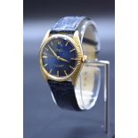 A vintage Rolex Oyster perpetual 18k gold automatic wristwatch, 34mm, on replacement blue leather