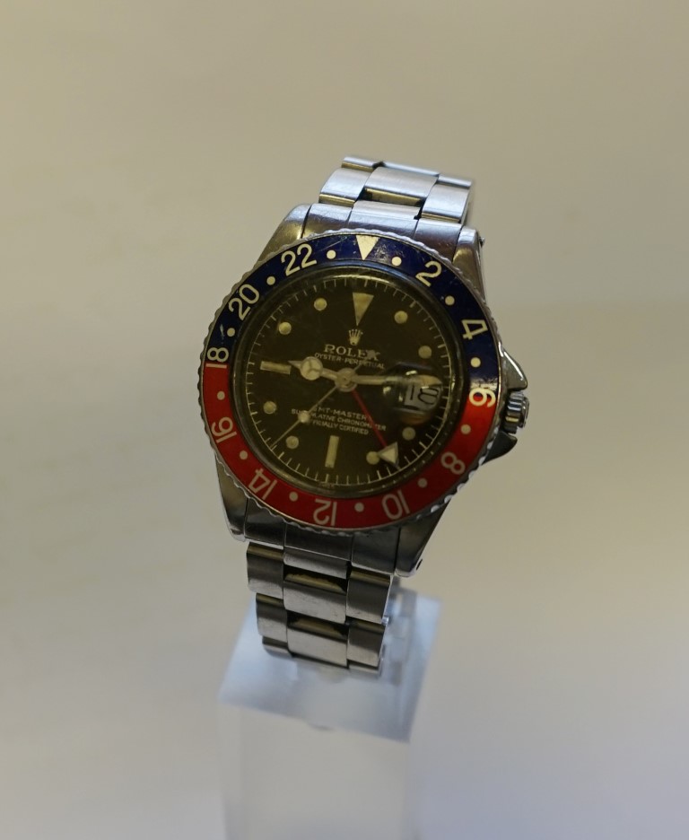 A 1960 Rolex 1675 'Tropical' GMT Master wristwatch, cal 1560, with 'Pepsi' bezel, 78360 Oyster