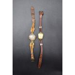 A 1930s 9ct gold ladies wristwatch; together with a vintage gold plated ladies wristwatch.