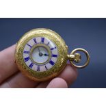 A 19th century Continental yellow metal and enamel stem wind fob watch, stamped 18k, 36mm.