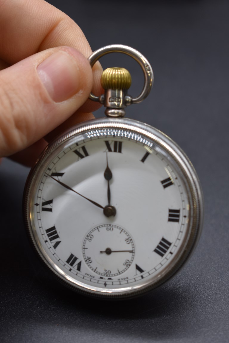 A silver open face stem wind pocket watch, 54mm.