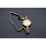 A Precista 18ct gold ladies quartz wristwatch, on an unmarked bracelet.