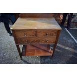 An early 20th century mahogany washstand, having raised back and one false drawer, 77cm wide x