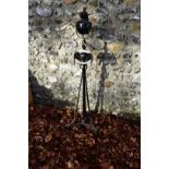 A black painted standard lamp, 138cm high.