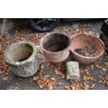 A garden pot decorated figures; together with two terracotta pots and a wall pocket.