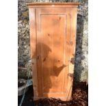 A pine single wardrobe, (in two parts), 83cm wide x 46cm deep x 183cm high.