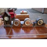 Three mantel clocks; together with three others.