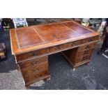 A reproduction mahogany partners' desk, 153cm wide x 92cm deep x 79cm high.
