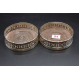 A pair of George III silver wine coasters, by P R? London 1794, 13cm diameter.