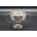 An Edwardian silver three handled bowl, by S Blanckensee & Son Ltd, Birmingham 1910, 10.5cm high,