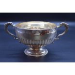 A Victorian silver twin handled pedestal bowl, by Wakely & Wheeler, London 1895, width including