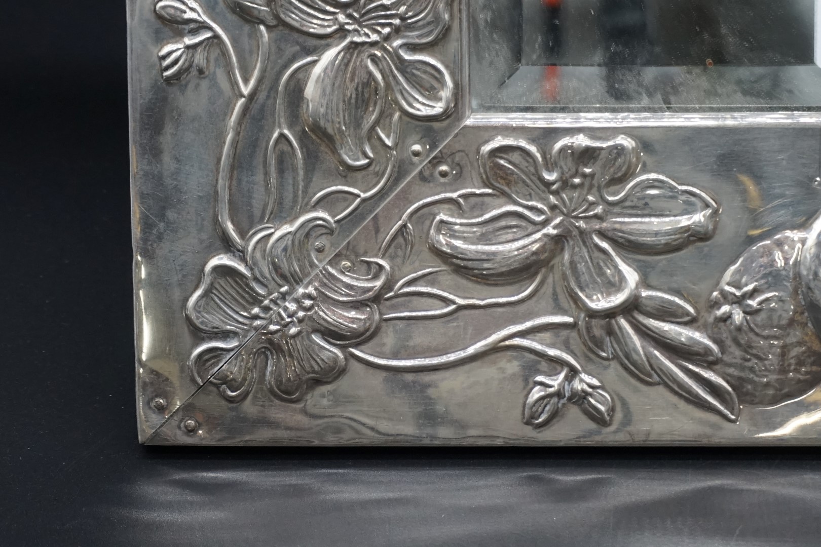 A silver framed easel back mirror, stamped 925, relief decorated with oranges and blossom, 42 x - Image 2 of 3