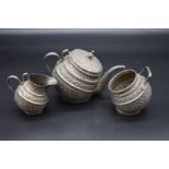 An unusual late 19th century Indian metal Kashmiri ?Kang-Style? tilted three piece tea set,