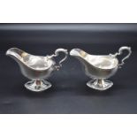 A good pair of George III cast silver sauce boats, by W B (probably William Bennett), London 1813,