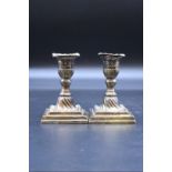 A pair of Victorian silver dwarf candlesticks, by John Round & Son Ltd, Sheffield 1893, 11.5cm high,