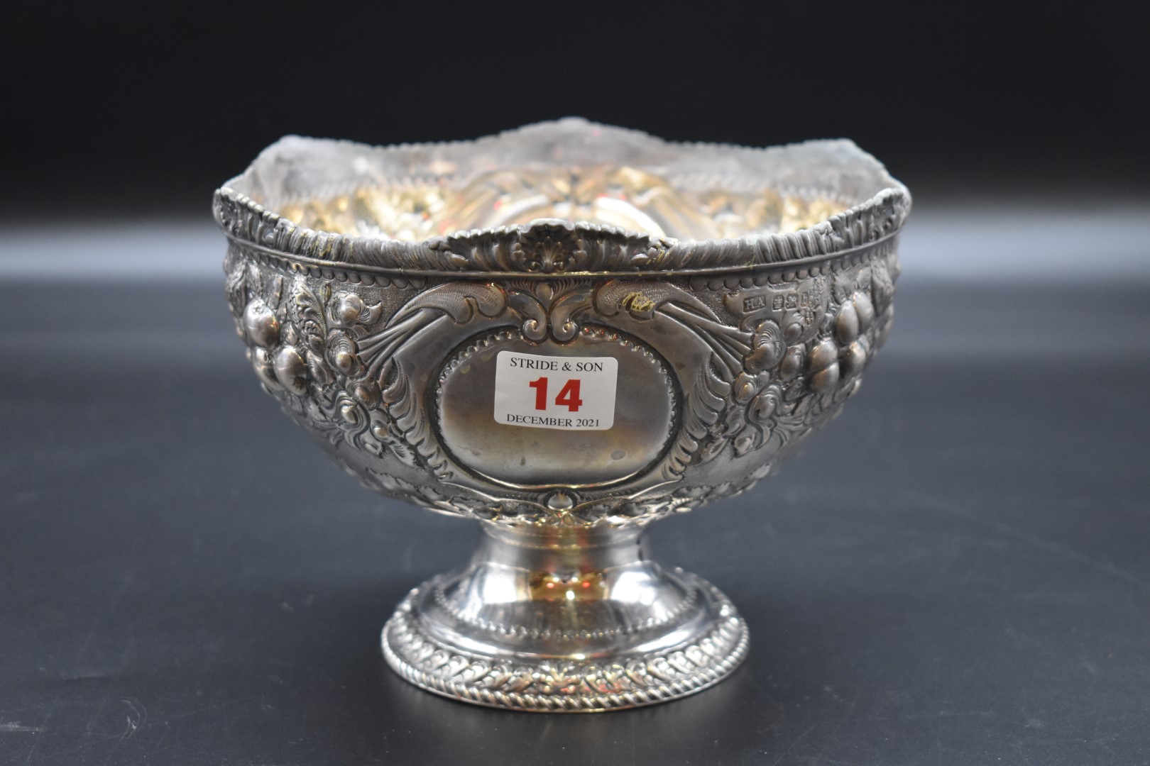 A Victorian embossed silver pedestal bowl, by Atkin Brothers, Sheffield 1894, relief decorated