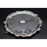 An Edwardian silver salver, having an ornate pierced scroll border, by Martin Hall & Co, Sheffield