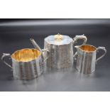 A Victorian silver three piece tea set, by Frederick Elkington, Birmingham 1872, with engraved