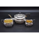 A silver three piece teaset, by G F Westwood & Sons, Birmingham, 1920, teapot 15.5cm high, gross