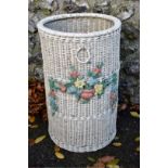 A Lloyd Loom wicker basket, decorated with flowers, 55cm high.