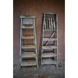 Two old wooden step ladders, largest 155cm high, smallest 145cm high.