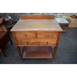 An antique mahogany washstand, with raised back, 54cm deep x 67cm wide.