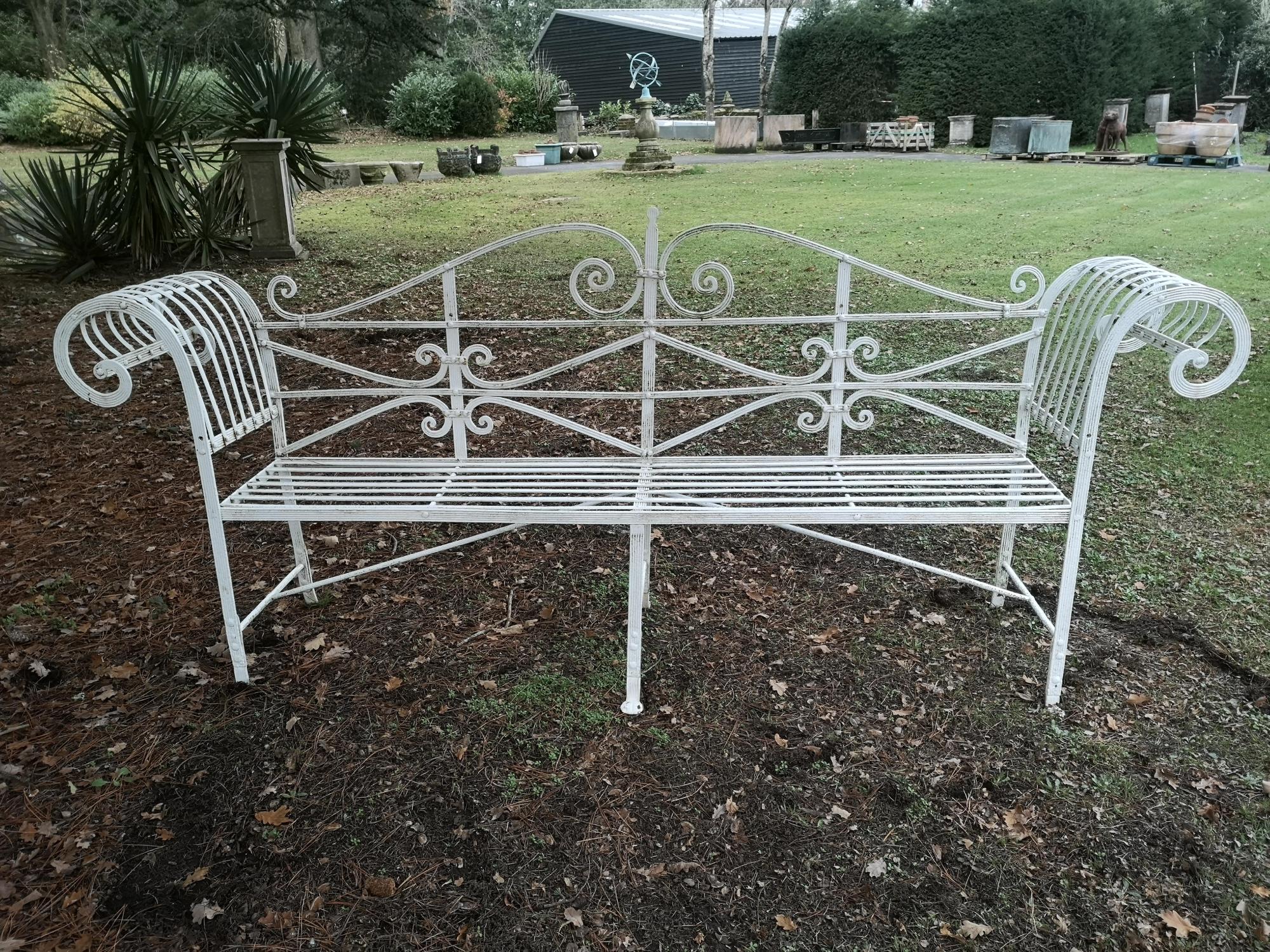 Garden seats: A Regency reeded wrought iron seat, early 19th century, 240cm wide