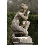 Garden statues: After the Antique: An Austin and Seeley composition stone figure of the crouching