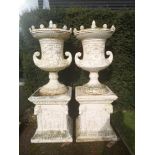 Garden pots and urns: A pair of impressive and unusual cast iron lidded finials on pedestals,