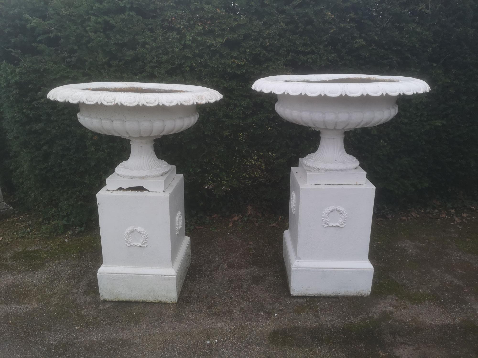 Garden pots and urns: A pair of large cast iron urns on pedestals, 2nd half 19th century, 126cm