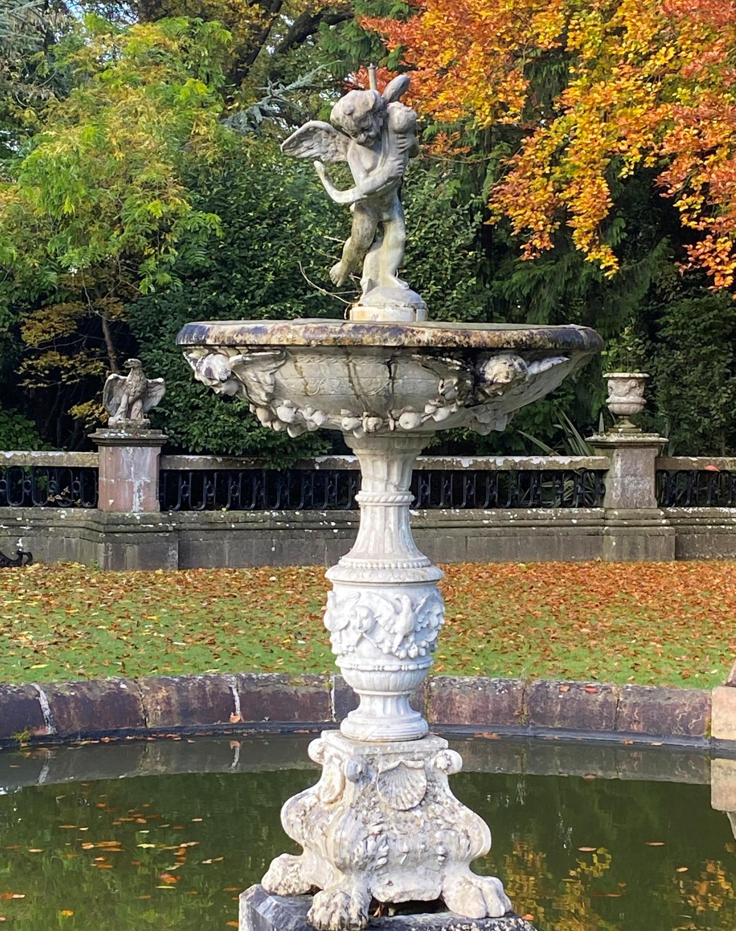 Water features and fountains: A carved white marble fountain, Italian, circa 1900, surmounted by a