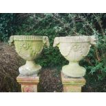 Garden pots and urns: A pair of carved stone urns, 19th century, 66cm high , From a Private