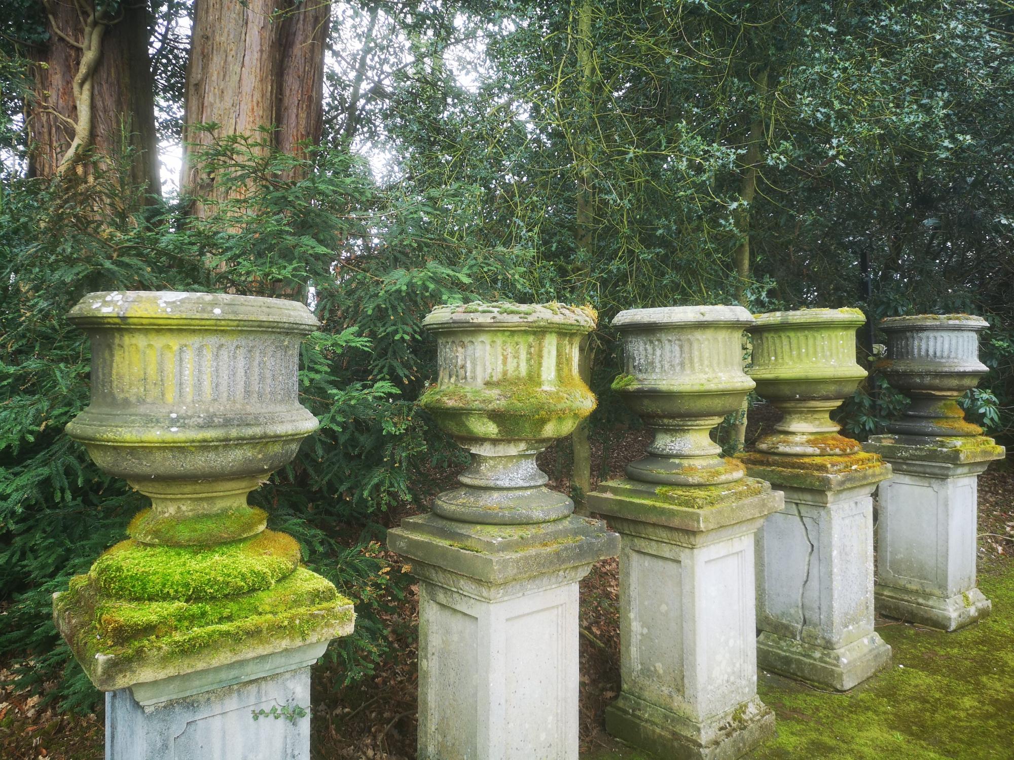 Garden pots and urns: A set of five Victorian carved sandstone urns, mid 19th century, 83cm high