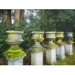 Garden pots and urns: A set of five Victorian carved sandstone urns, mid 19th century, 83cm high