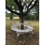 Garden seats: An Arras wrought iron tree seat in two halves, early 20th century, with maker’s