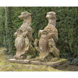 Garden statues: A pair of Victorian carved red sandstone armorial gate pier beasts, circa 1860,