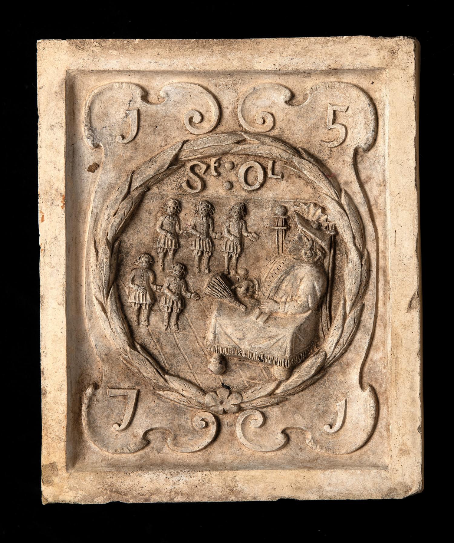 Garden statues: A Coade stone boundary marker plaque depicting the seal of St Olave’s school and its