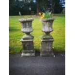 Garden pots and urns: A pair of composition stone urns on pedestals, 2nd half 20th century, 90cm,