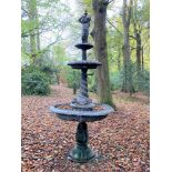 Water features and fountains: A bronze three tier fountain with putto and entwined dolphins, late