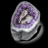 Minerals: An amethyst geode with calcite crystalsBrazil29cm by 27cm