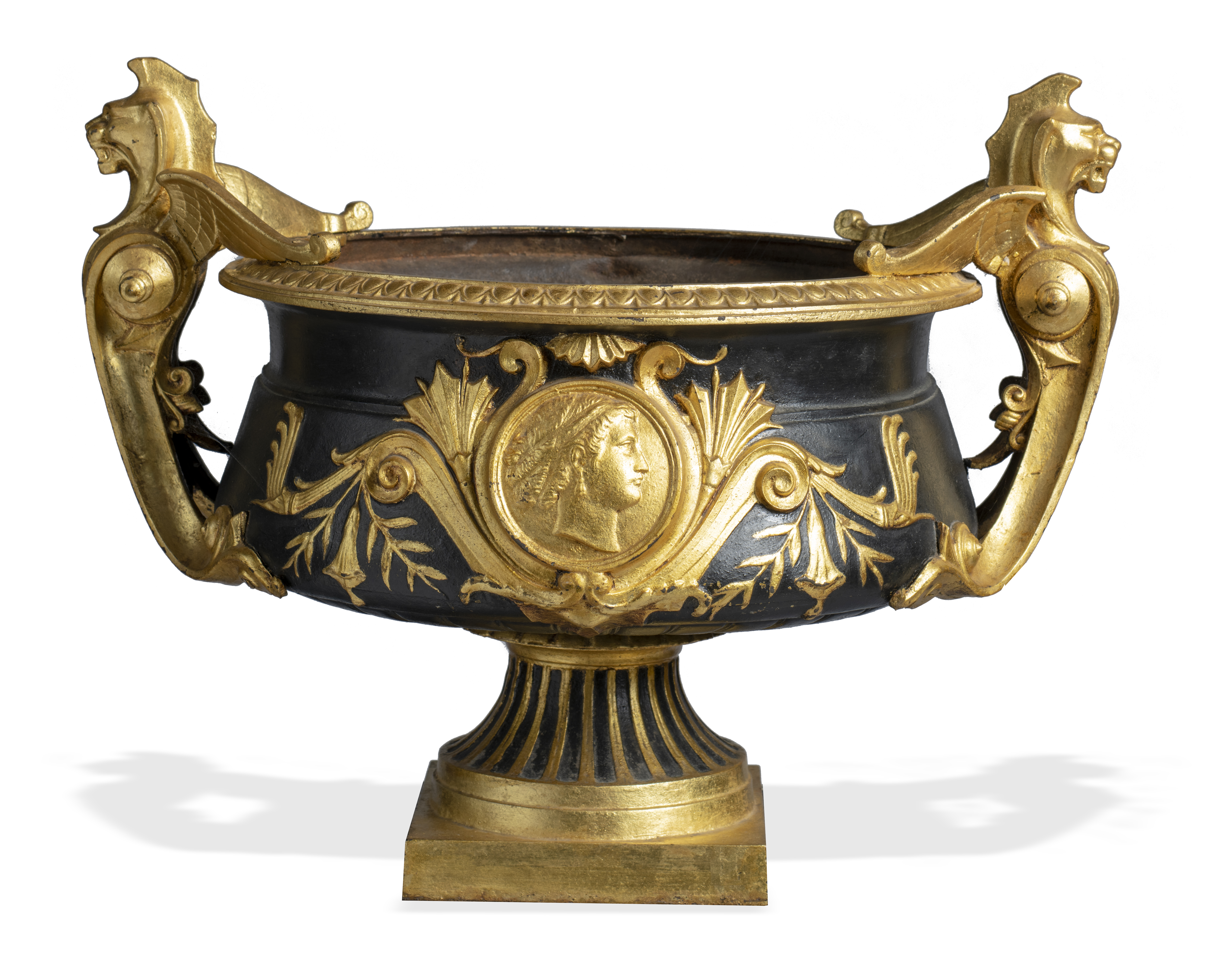 An unusual cast iron, painted and gilded urn