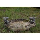 A marble and lead birdbath