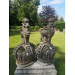 A pair of unusual composition stone armorial crowns