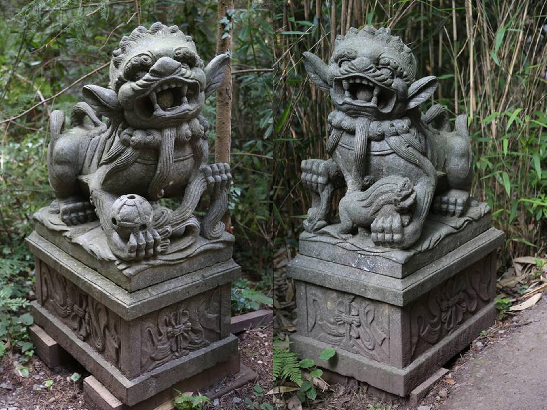 A pair of carved granite shi shi dogs on pedestals