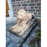 A pair of rare terracotta reclining lions